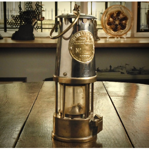 A ‘Type 6’ Glass, Pressed-Steel and Brass Miner’s Lamp by The Protector Lamp and Lighting Co. Ltd., Eccles, Manchester.