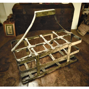 A Vintage Pressed-Metal Bottle Carrier